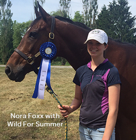 Nora Foxx holding "Wild For Summer"